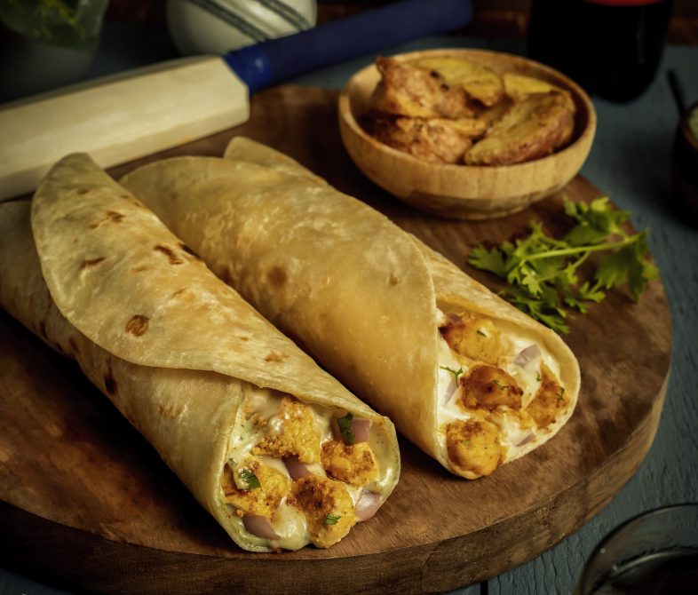 delicious-wraps-and-fries-on-wooden-cutting-board-2026-03-18-11-03-34-utc
