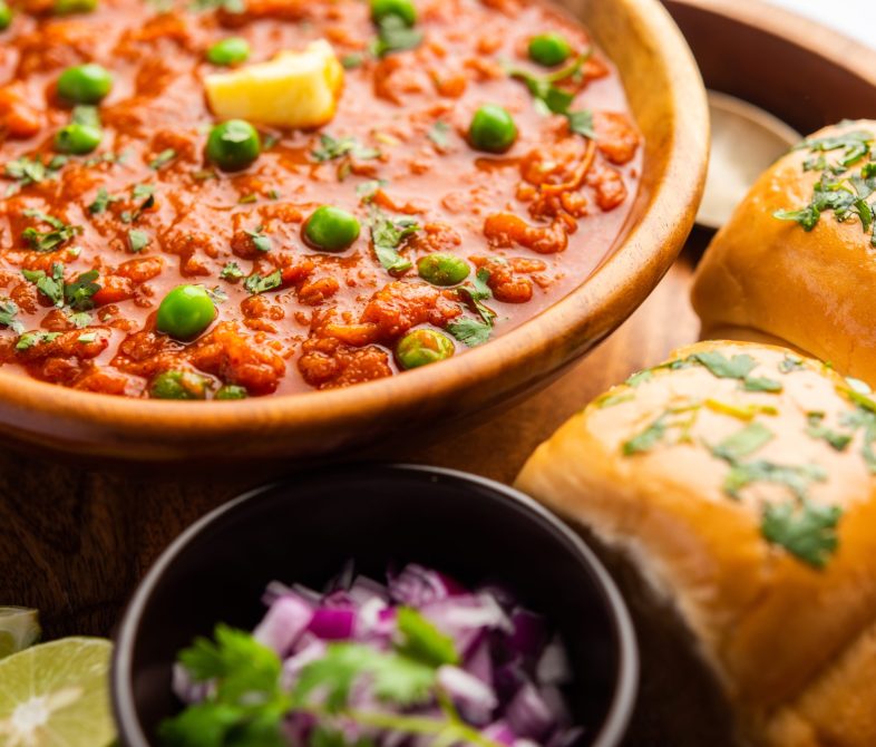Pav bhaji is a fast food dish from India consisting of a thick vegetable curry served with a soft bread roll